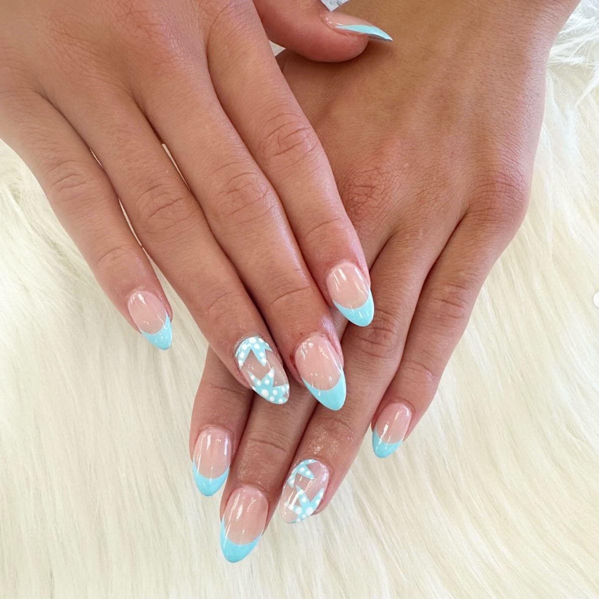 Baby blue French tips with polka-dot accent nail