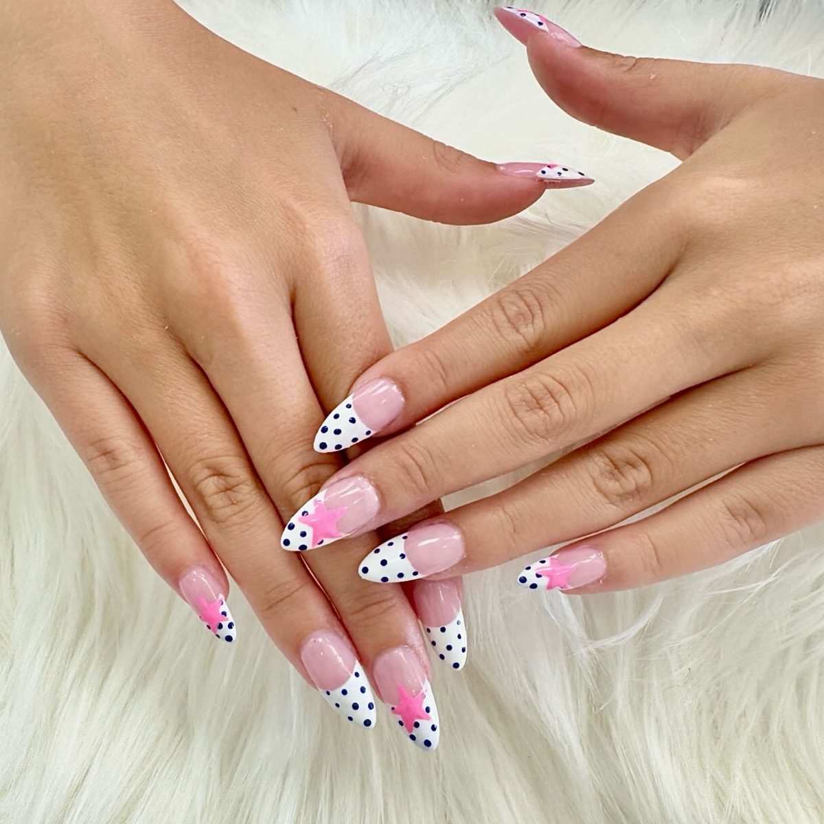 White polka-dot French tips with pink star accent